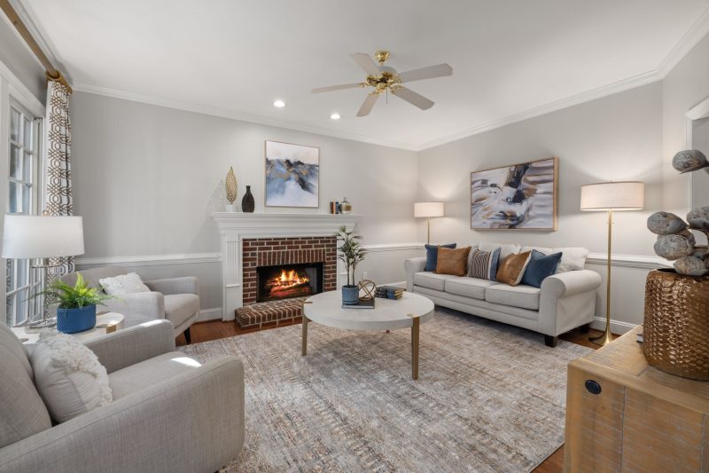 Home 12 A cozy modern living room featuring a fireplace elegant sofa 1788282050