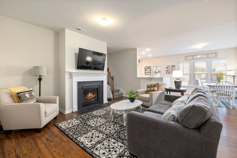 Home 12 Spacious living room featuring a fireplace TV and comfortabl 1790701286
